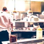 Chef in stainless steel restaurant kitchen. Did the kitchen installer provide the chef with a warranty for the benches. Did it have terms and conditions